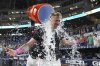 Miami Marlins' Kyle Stowers is doused with ice after hitting a walk-off grand slam in the ninth inning of a baseball game against the Oakland Athletics, Saturday, May 3, 2025, in Miami. (AP Photo/Lynne Sladky)
