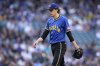 Seattle Mariners starting pitcher Logan Gilbert walks off the field after the second inning against the Miami Marlins of a baseball game, Friday, April 25, 2025, in Seattle. (AP Photo/John Froschauer)