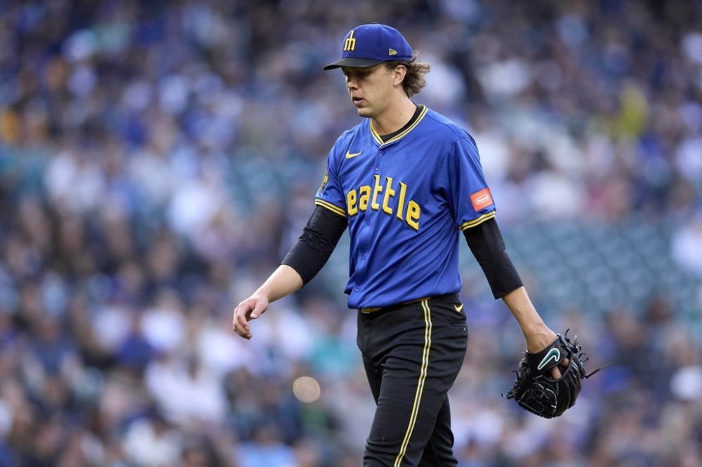 Seattle Mariners starting pitcher Logan Gilbert walks off the field after the second inning against the Miami Marlins of a baseball game, Friday, April 25, 2025, in Seattle. (AP Photo/John Froschauer)