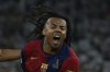 Barcelona's Jules Kounde celebrates after scoring his side's third goal during the Spanish Copa del Rey final soccer match between Barcelona and Real Madrid at Estadio de La Cartuja stadium in Seville, Spain, Sunday, April 27, 2025. (AP Photo/Joan Monfort)