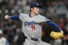 Los Angeles Dodgers pitcher Roki Sasaki (11) delivers against the Atlanta Braves in the second inning of a baseball game, Saturday, May 3, 2025, in Atlanta. (AP Photo/Mike Stewart)