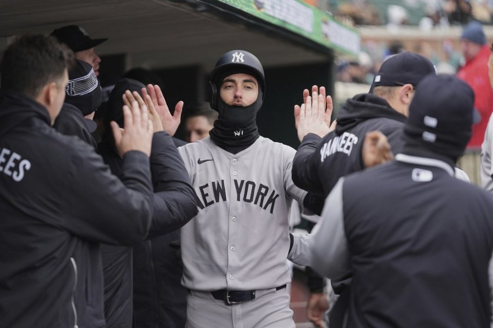 New York Yankees' Cody Bellinger celebrates scoring against the Detroit Tigers in the eighth inning during a baseball game, Monday, April 7, 2025, in Detroit. (AP Photo/Paul Sancya)