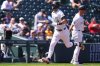 Colorado Rockies' Brenton Doyle, front, is congratulated after hitting a solo home run by third base coach Warren Schaeffer in the first inning of a baseball game against the Milwaukee Brewers, Thursday, April 10, 2025, in Denver. (AP Photo/David Zalubowski)