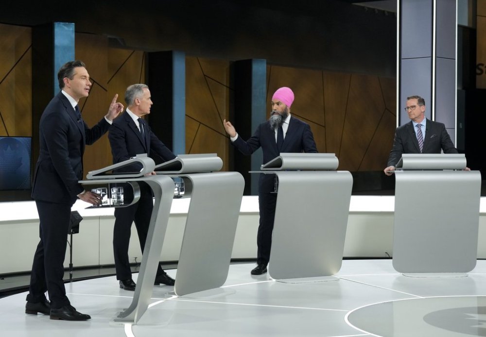 Conservative Leader Pierre Poilievre, left to right, Liberal Leader Mark Carney and New Democratic Party Leader Jagmeet Singh and Bloc Québécois Leader Yves-François Blanchet participate in the English-language federal leaders' debate in Montreal, Thursday, April 17, 2025. THE CANADIAN PRESS/Adrian Wyld
