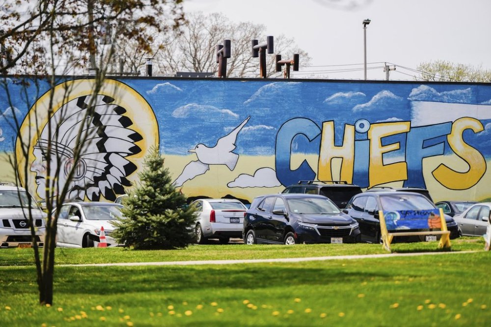 A mural adorns a wall next to the Massapequa High School, in Massapequa, N.Y., Friday, April 25, 2025. (AP Photo/Julia Demaree Nikhinson)