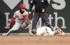 St. Louis Cardinals shortstop Masyn Winn, left, comes up short on a tag against Boston Red Sox's Jarren Duran, right, in the fifth inning during the second baseball game of a doubleheader, Sunday, April 6, 2025, in Boston. (AP Photo/Mark Stockwell)