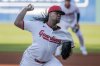 Cleveland Guardians starting pitcher Luis Ortiz (45) delivers against the Kansas City Royals during the first inning of a baseball game in Cleveland, Saturday, April 12, 2025. (AP Photo/Phil Long)