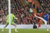 Liverpool's Mohamed Salah, center, heads the ball at goal which Everton's goalkeeper Jordan Pickford saved during the English Premier League soccer match between Liverpool and Everton at Anfield in Liverpool, Wednesday, April 2, 2025. (AP Photo/Ian Hodgson)