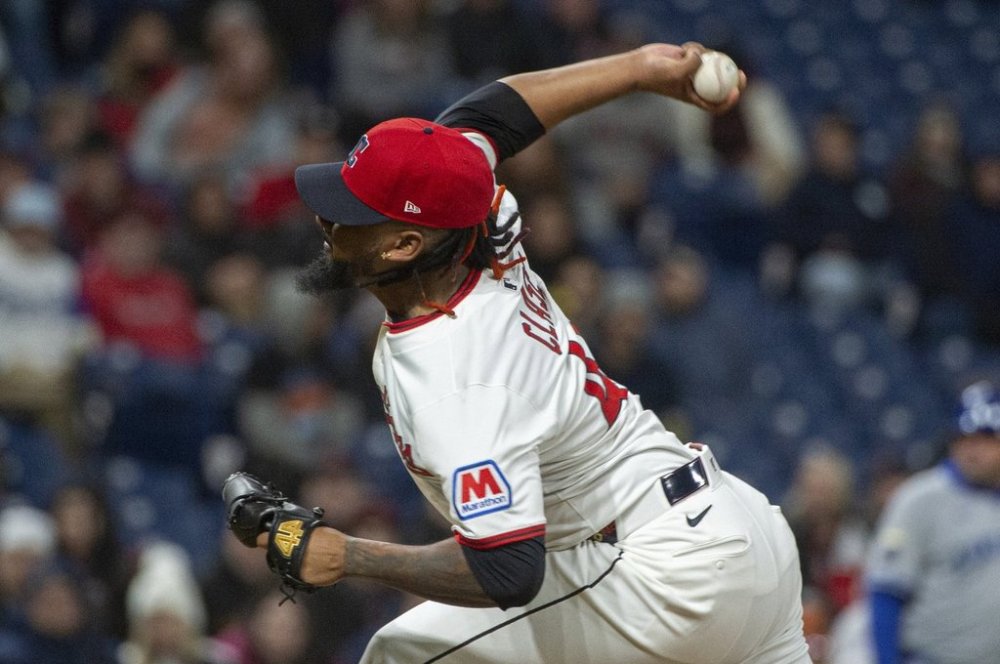 Cleveland Guardians relief pitcher Emmanuel Clase delivers during the ninth inning of a baseball game against the Kansas City Royals in Cleveland, Saturday, April 12, 2025. (AP Photo/Phil Long)