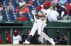 Washington Nationals third baseman José Tena hits an RBI double during the seventh inning in the first baseball game of a doubleheader against the Cleveland Guardians, Tuesday, May 6, 2025, in Washington. (AP Photo/Daniel Kucin Jr.)