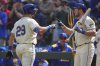 Seattle Mariners' Cal Raleigh (29) greets Luke Raley, right, after hitting a two-run home run against the Texas Rangers during the first inning of a baseball game Sunday, April 13, 2025, in Seattle. (AP Photo/Lindsey Wasson)