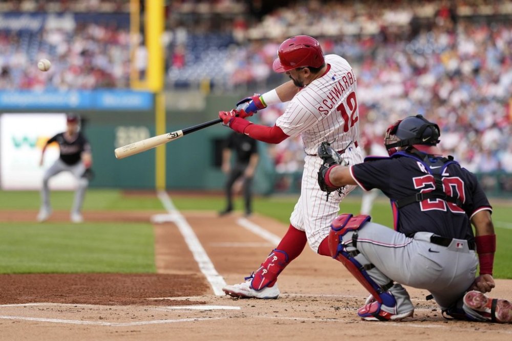 Philadelphia Phillies' Kyle Schwarber hits a two-run home run against Washington Nationals pitcher MacKenzie Gore during the first inning of a baseball game, Tuesday, April 29, 2025, in Philadelphia. (AP Photo/Matt Slocum)