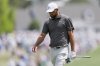 Scottie Scheffler walks to the green on the first hole during the third round at the Masters golf tournament, Saturday, April 12, 2025, in Augusta, Ga. (AP Photo/Matt Slocum)