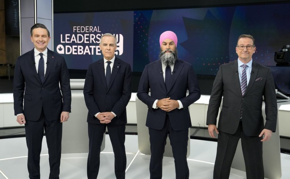 Conservative Leader Pierre Poilievre, left to right, Liberal Leader Mark Carney, New Democratic Party Leader Jagmeet Singh, and Bloc Quebecois Leader Yves-Francois Blanchet, take part in a group photo prior participating in the English-language federal leaders' debate, in Montreal, Thursday, April 17, 2025. THE CANADIAN PRESS/Adrian Wyld