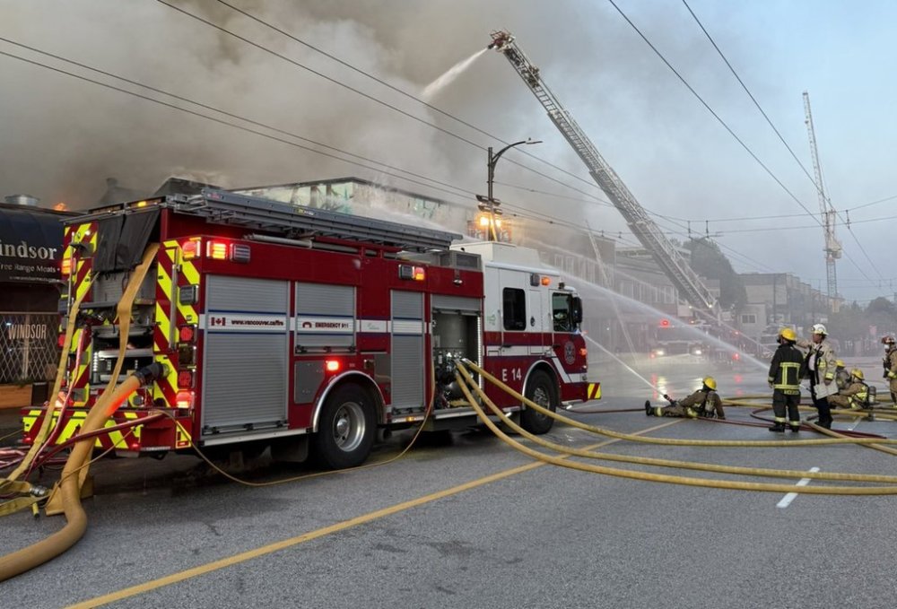 Firefighters are shown fighting a large blaze in Vancouver in this April 23, 2025 handout photo. THE CANADIAN PRESS/HO — Twitter, Vancouver Fire Rescue Services **MANDATORY CREDIT**
