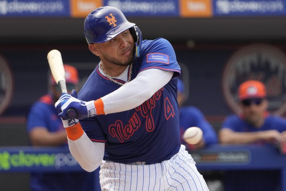 FILE - New York Mets' Francisco Alvarez takes a ball during the fourth inning of a spring training baseball game against the Houston Astros Thursday, Feb. 27, 2025, in Port St. Lucie, Fla. (AP Photo/Jeff Roberson,File)