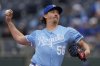 Kansas City Royals relief pitcher Hunter Harvey throws during the ninth inning of a baseball game against the Cleveland Guardians, Sunday, March 30, 2025, in Kansas City, Mo. (AP Photo/Charlie Riedel)