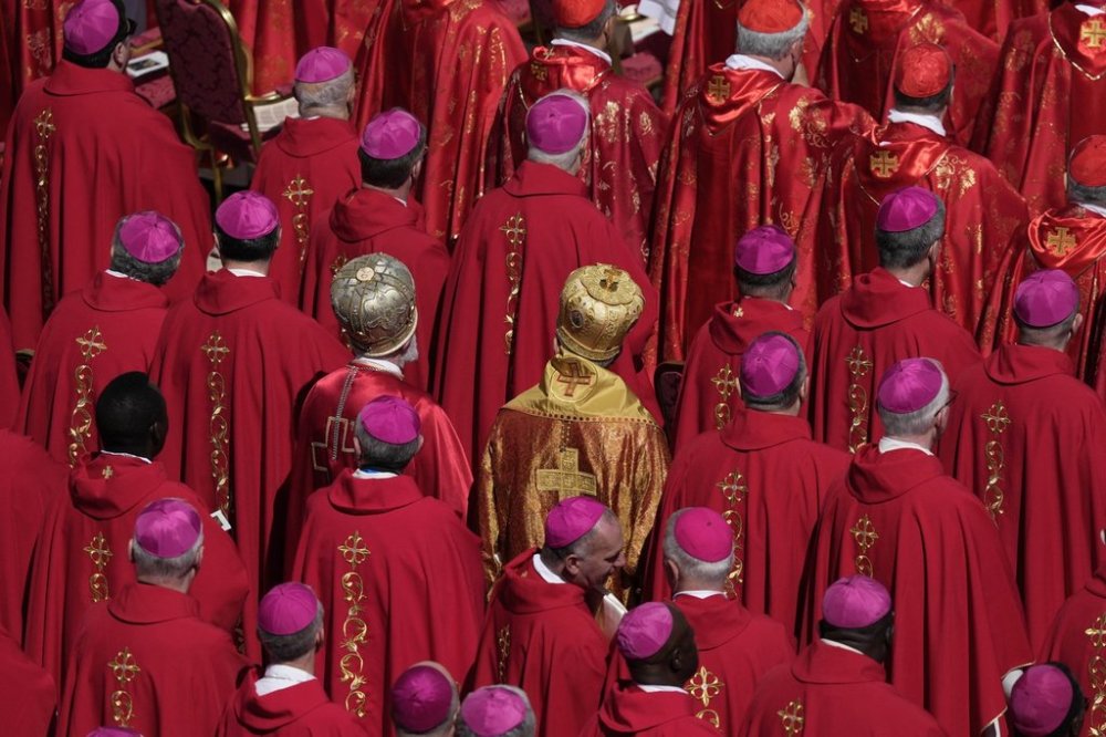 Cardinals stand during the funeral of Pope Francis in St. Peter's Square at the Vatican, Saturday, April 26, 2025. (AP Photo/Gregorio Borgia)