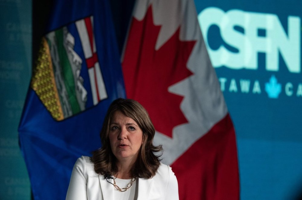 Alberta Premier Danielle Smith responds to a question following a speech at the Canada Strong and Free Network national conference, Thursday, April 10, 2025 in Ottawa. THE CANADIAN PRESS/Adrian Wyld