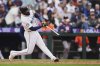 Seattle Mariners' Randy Arozarena hits a grand slam against the Houston Astros during the eighth inning of a baseball game Wednesday, April 9, 2025, in Seattle. (AP Photo/Lindsey Wasson)