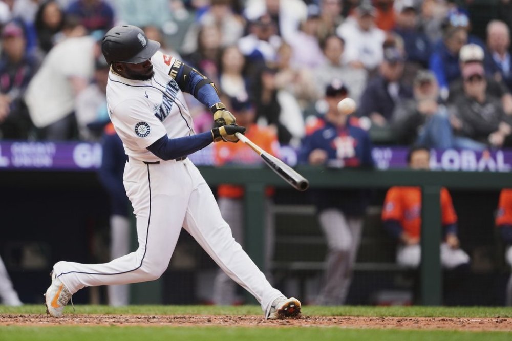 Seattle Mariners' Randy Arozarena hits a grand slam against the Houston Astros during the eighth inning of a baseball game Wednesday, April 9, 2025, in Seattle. (AP Photo/Lindsey Wasson)