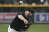 Arizona Diamondbacks pitcher Corbin Burnes throws against the Milwaukee Brewers in the first inning during a baseball game, Saturday, April 12, 2025, in Phoenix. (AP Photo/Rick Scuteri)