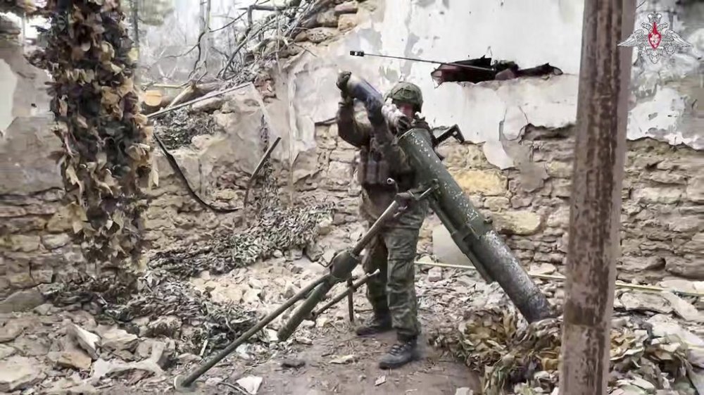 In this photo taken from video distributed by Russian Defense Ministry Press Service on Tuesday, April 8, 2025, Russian 120mm mortar crew fire toward Ukrainian position at an undisclosed location in Ukraine. (Russian Defense Ministry Press Service via AP)