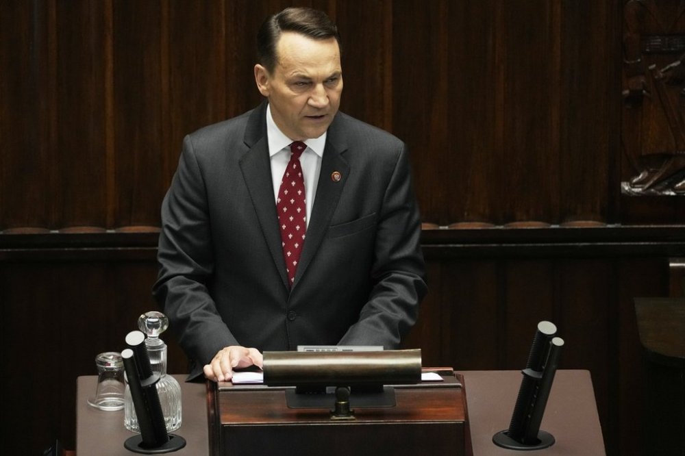 Poland's Foreign Minister Radek Sikorski gives a speech at the parliament on Wednesday, April 23, 2025, in Warsaw, Poland. (AP Photo/Czarek Sokolowski)