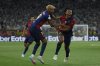 Barcelona's Jules Kounde, right, celebrates after scoring his side's third goal during the Spanish Copa del Rey final soccer match between Barcelona and Real Madrid at Estadio de La Cartuja stadium in Seville, Spain, Sunday, April 27, 2025. (AP Photo/Joan Monfort)