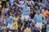 Manchester City's Kevin De Bruyne, center, celebrates scoring his side's first goal during the English Premier League soccer match between Manchester City and Crystal Palace at the Etihad stadium in Manchester, England, Saturday, April 12, 2025. (Martin Rickett/PA via AP)