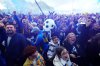 Leeds United fans celebrate their promotion to the Premier League outside the stadium during the Championship soccer match between Leeds United and Stoke City at Elland Road, Leeds, England, Monday April 21, 2025. (Mike Egerton/PA via AP)