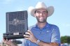 Scottie Scheffler holds the winner's trophy of the CJ Cup Byron Nelson golf tournament in McKinney, Texas, Sunday, May 4, 2025. (AP Photo/LM Otero)
