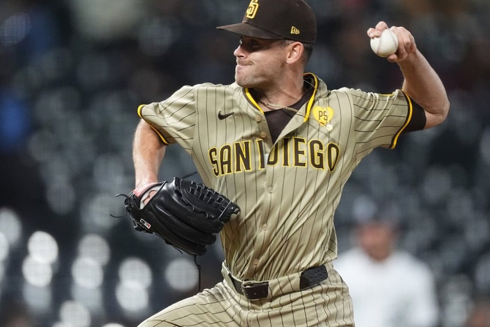 San Diego Padres pitcher Tom Cosgrove (59) in the eighth inning of a baseball game Tuesday, April 23, 2024, in Denver. (AP Photo/David Zalubowski)