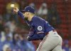 Texas Rangers pitcher Nathan Eovaldi throws during the first inning of a baseball game against the Boston Red Sox, Tuesday, May 6, 2025, in Boston. (AP Photo/Mark Stockwell)