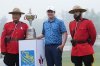 Scotland's Robert MacIntyre, centre, poses for photos with RCMP officers and the championship trophy with RCMP officers after winning the Canadian Open golf tournament in Hamilton, Ontario on Sunday, June 2, 2024. THE CANADIAN PRESS/Nathan Denette