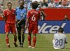Canada's Paul Stalteri (7) pleads with referee Courtney Campbell of Jamaica, blue shirt, after he received a yellow card caution for tripping Guatemala's Carlos Ruiz (20) during their CONCACAF Gold Cup quarterfinal soccer match in Foxborough, Mass., Saturday afternoon, June 16, 2007. Canada's Julian De Guzman (6) walks over to join in the discussion. (AP Photo/Stephan Savoia)