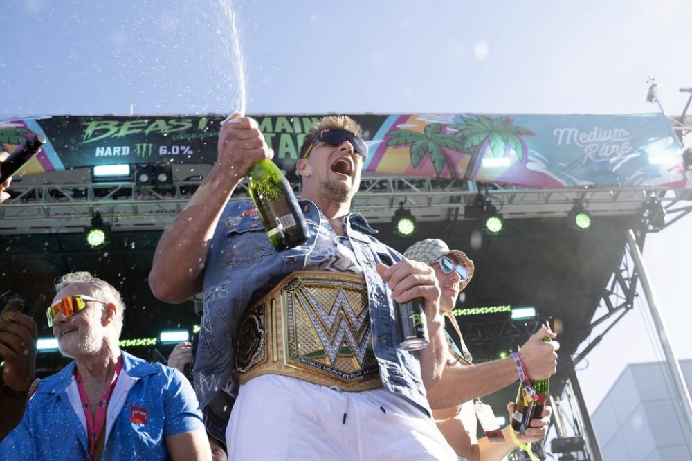 FILE 0-Rob Gronkowski, wearing a wrestling championship belt, makes an appearance at Gronk Beach music festival during Super Bowl week on Saturday, Feb. 11, 2023, at Talking Stick Resort in Scottsdale, Ariz. (Photo by Mark Peterman/Invision/AP, File)