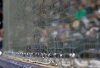 FILE - Newly installed netting at Safeco Field designed to protect fans from foul balls and flying bats is shown above the visitors' dugout during a baseball game between the Seattle Mariners and the Cleveland Indians, Thursday, March 29, 2018, in Seattle. (AP Photo/Ted S. Warren, File)