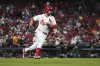 St. Louis Cardinals' Alec Burleson rounds first on his way to a two-run double during the sixth inning of a baseball game against the Pittsburgh Pirates Tuesday, May 6, 2025, in St. Louis. (AP Photo/Jeff Roberson)