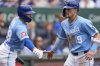 Kansas City Royals' Michael Massey (19) celebrates with Kyle Isbel after scoring on a single by Drew Waters during the third inning of the first baseball game of a doubleheader against the Colorado Rockies, Thursday, April 24, 2025, in Kansas City, Mo. (AP Photo/Charlie Riedel)