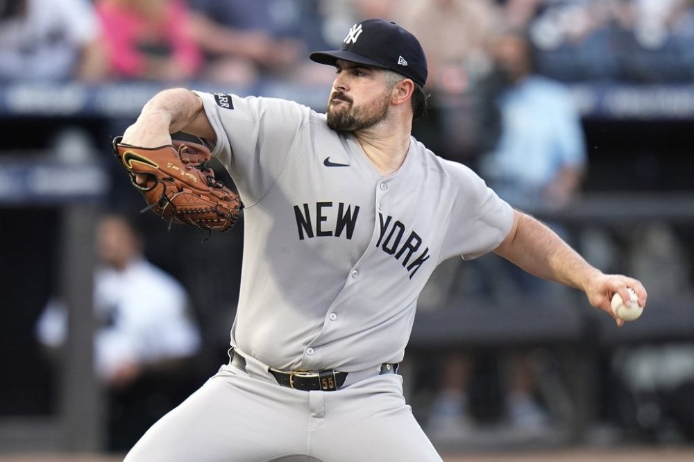 New York Yankees pitcher Carlos Rodón delivers to the Tampa Bay Rays during the first inning of a baseball game Friday, April 18, 2025, in Tampa, Fla. (AP Photo/Chris O'Meara)
