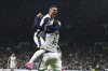 Tottenham's Pedro Porro celebrates with James Maddison after scoring his side's first goal during the Europa League quarterfinals first leg soccer match between Tottenham Hotspur and Eintracht Frankfurt at the Tottenham Hotspur Stadium in London, England, Thursday, April 10, 2025. (AP Photo/Frank Augstein)