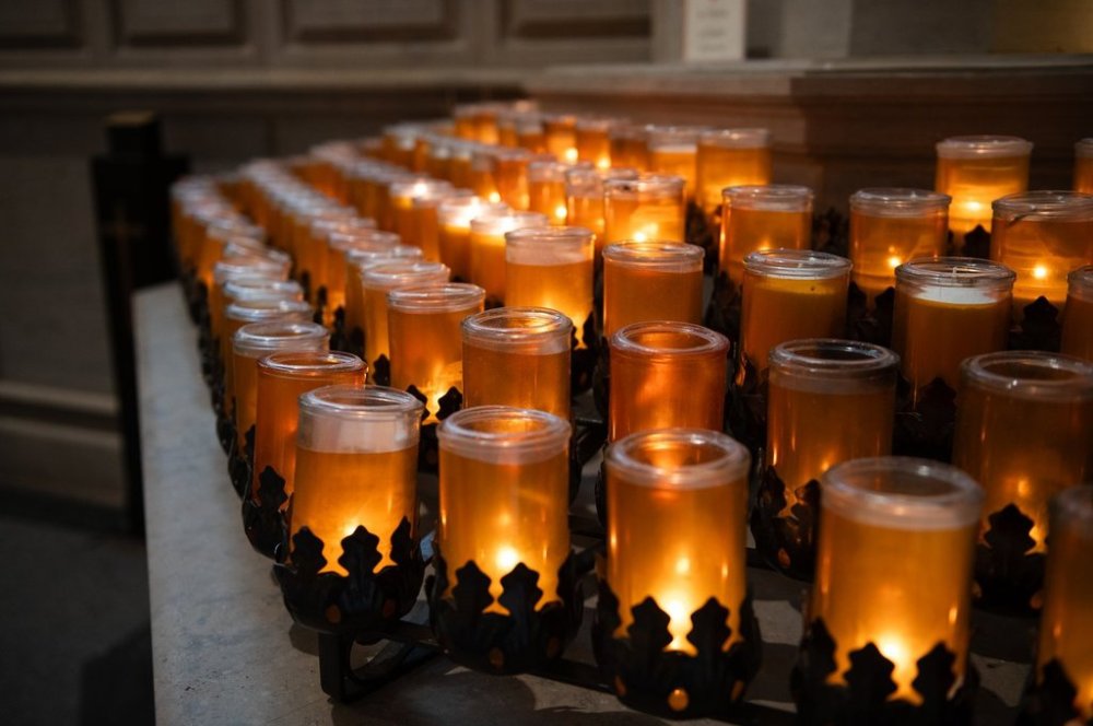 Votive candles are lit inside St. Michael's Cathedral Basilica in Toronto after the death of Pope Francis, on Monday, April 21, 2025. THE CANADIAN PRESS/Laura Proctor