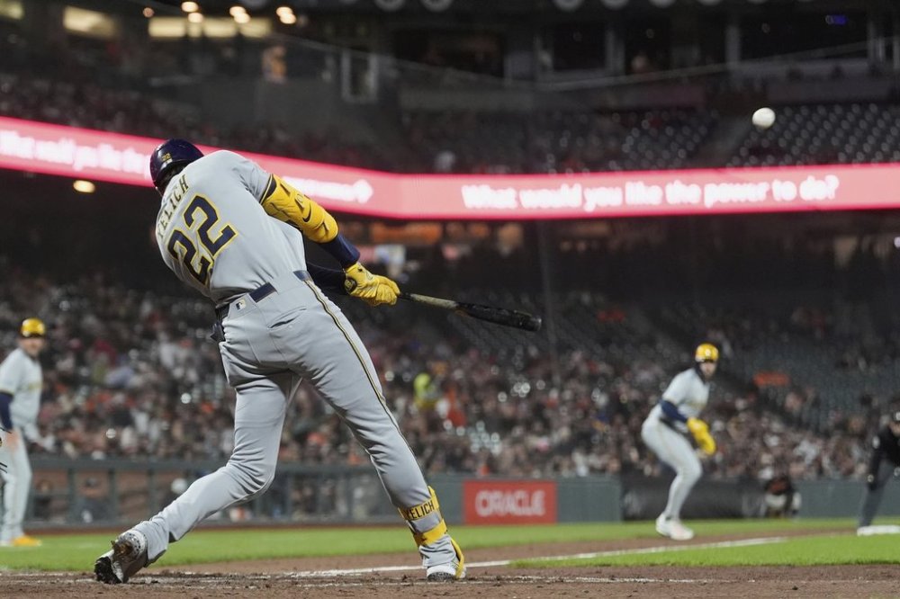 Milwaukee Brewers' Christian Yelich hits a grand slam against the San Francisco Giants during the sixth inning of a baseball game in San Francisco, Tuesday, April 22, 2025. (AP Photo/Jeff Chiu)