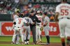 Benches clear as Baltimore Orioles' Heston Kjerstad (13) and New York Yankees second baseman Pablo Reyes (19) argue after Kjerstad stole second base during the fourth inning of a baseball game, Wednesday, April 30, 2025, in Baltimore. (AP Photo/Stephanie Scarbrough)