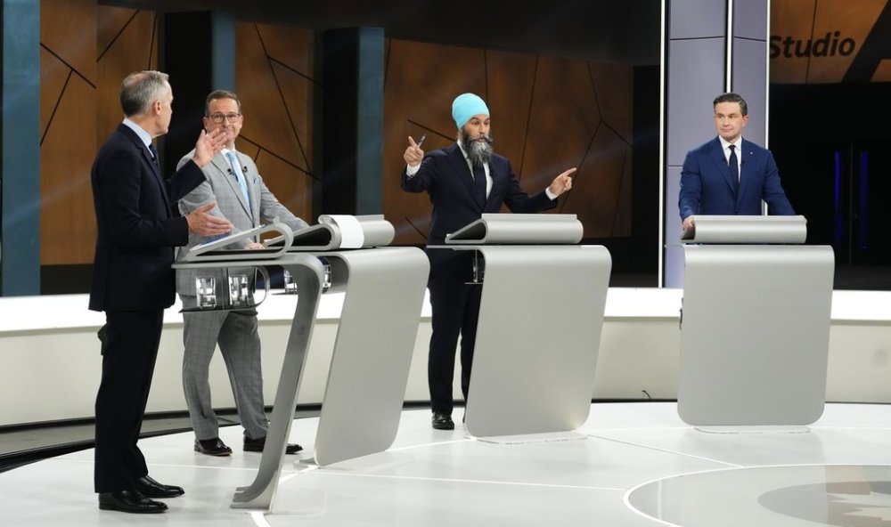 Conservative Leader Pierre Poilievre, Bloc Quebecois Leader Yves-Francois Blanchet and Liberal Leader Mark Carney watch as New Democratic Party Leader Jagmeet Singh points to multiple people during the French-language federal leaders' debate, in Montreal, Wednesday, April 16, 2025. THE CANADIAN PRESS/Sean Kilpatrick