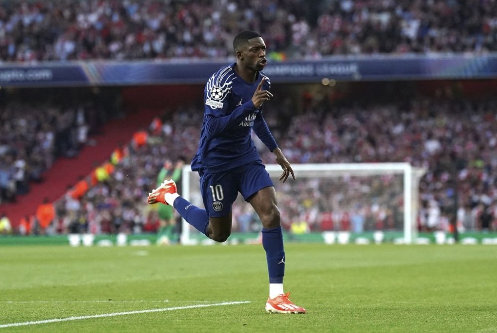 Paris Saint Germain's Ousmane Dembele celebrates after scoring the opening goal during the Champions League semifinal first leg soccer match between Arsenal and Paris Saint-Germain at Emirates Stadium in London, England, Tuesday, April 29, 2025. (Adam Davy/PA via AP)
