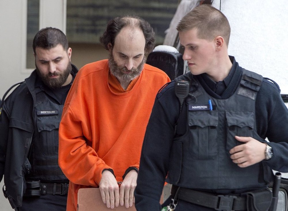 Matthew Vincent Raymond is escorted from provincial court in Fredericton on Friday, Feb. 8, 2019. THE CANADIAN PRESS/Andrew Vaughan