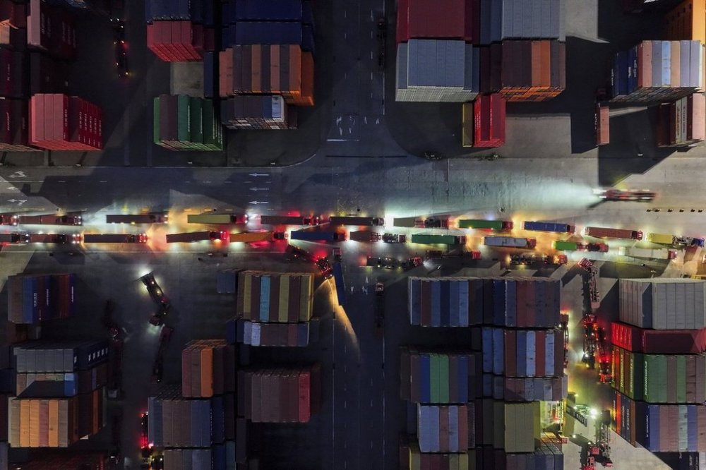 Trucks line up to depart from a container terminal in Nanjing in east China's Jiangsu province on Tuesday, April 8, 2025. (Chinatopix Via AP)