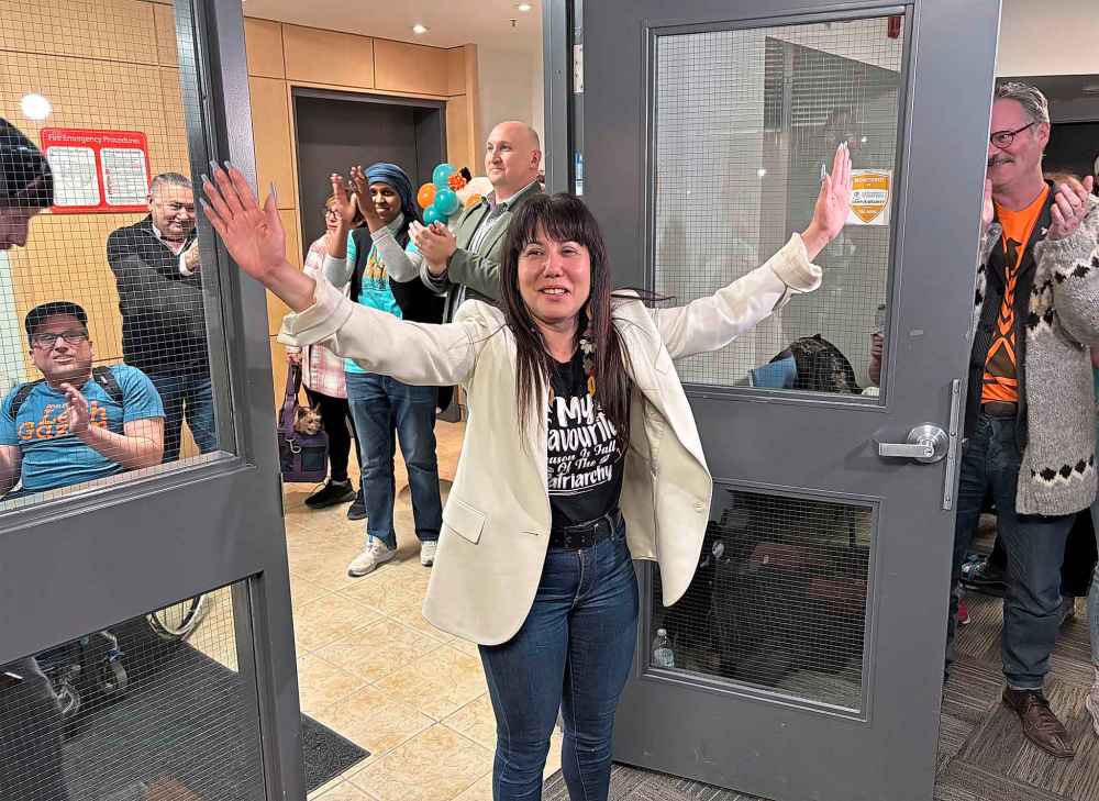 Winnipeg Centre MP Leah Gazan greets supporters at her headquarters after being declared the winner shortly before 11 p.m., Tuesday. She entered the packed room to cheers of “Leah! Leah!” (Arron Epp / Free Press)
